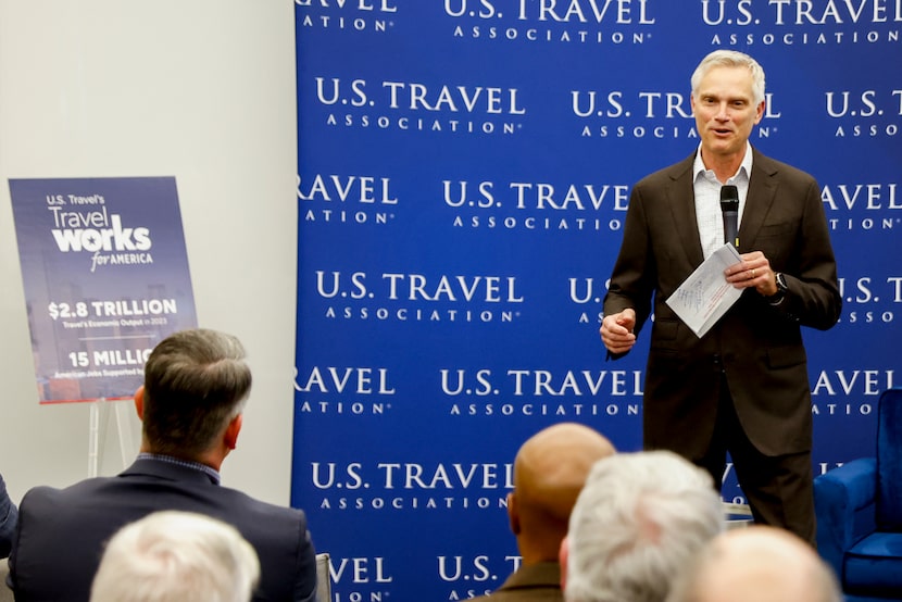 American Airlines CEO Robert Isom introduces Gov. Greg Abbott before a a fireside chat with...