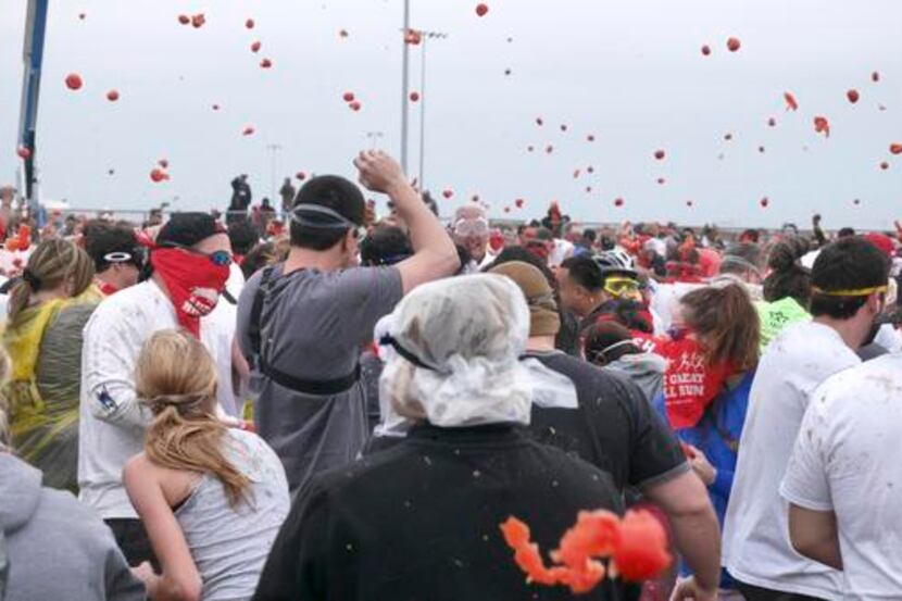 
Saturday’s Tomato Royale, a giant tomato food fight, was inspired by the annual La Tomatina...