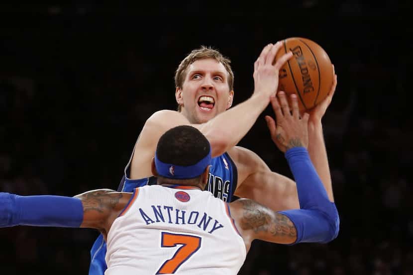 Dallas Mavericks' Dirk Nowitzki works to get open before shooting the game-winning basket...