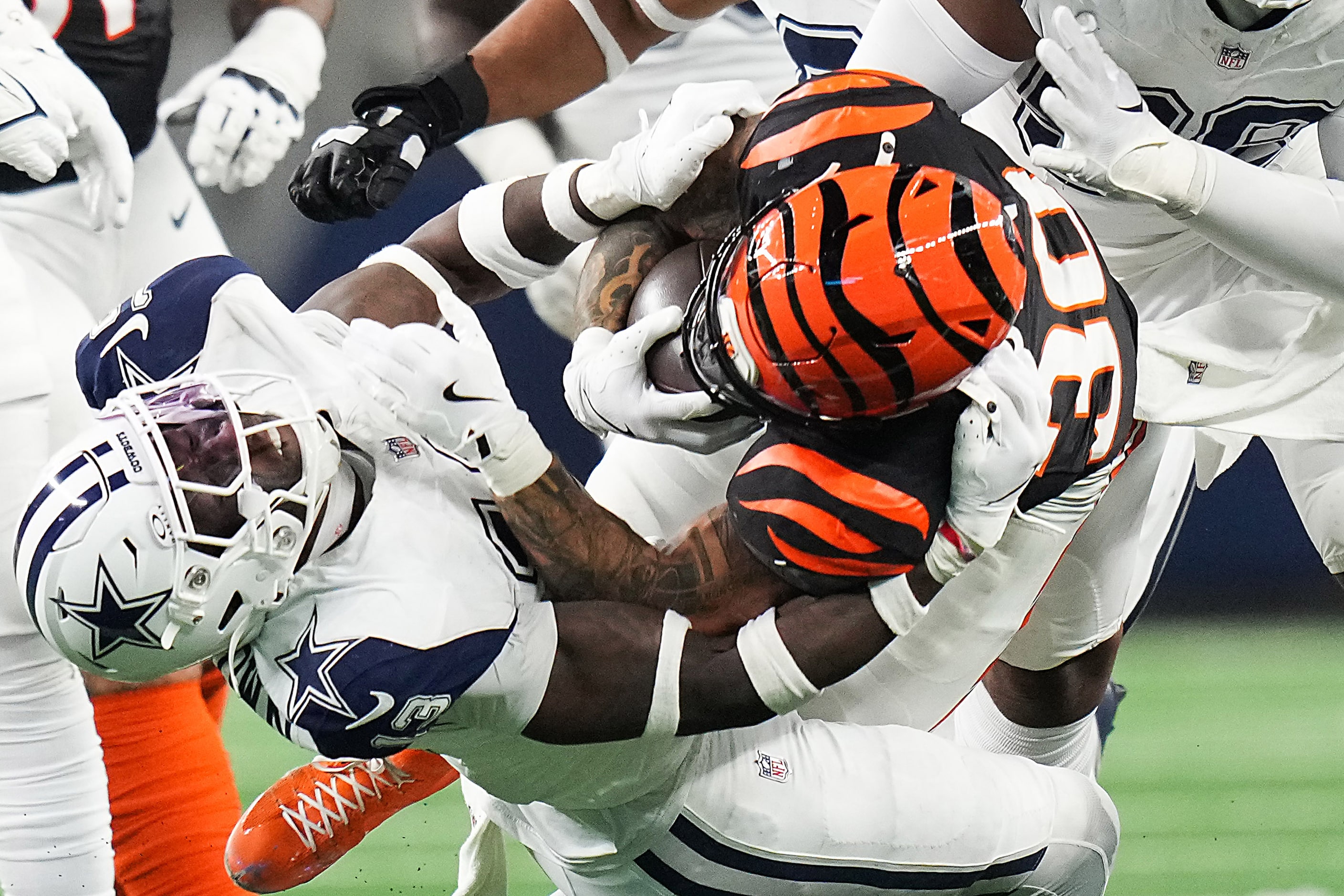 Dallas Cowboys linebacker DeMarvion Overshown (13) brings down Cincinnati Bengals running...