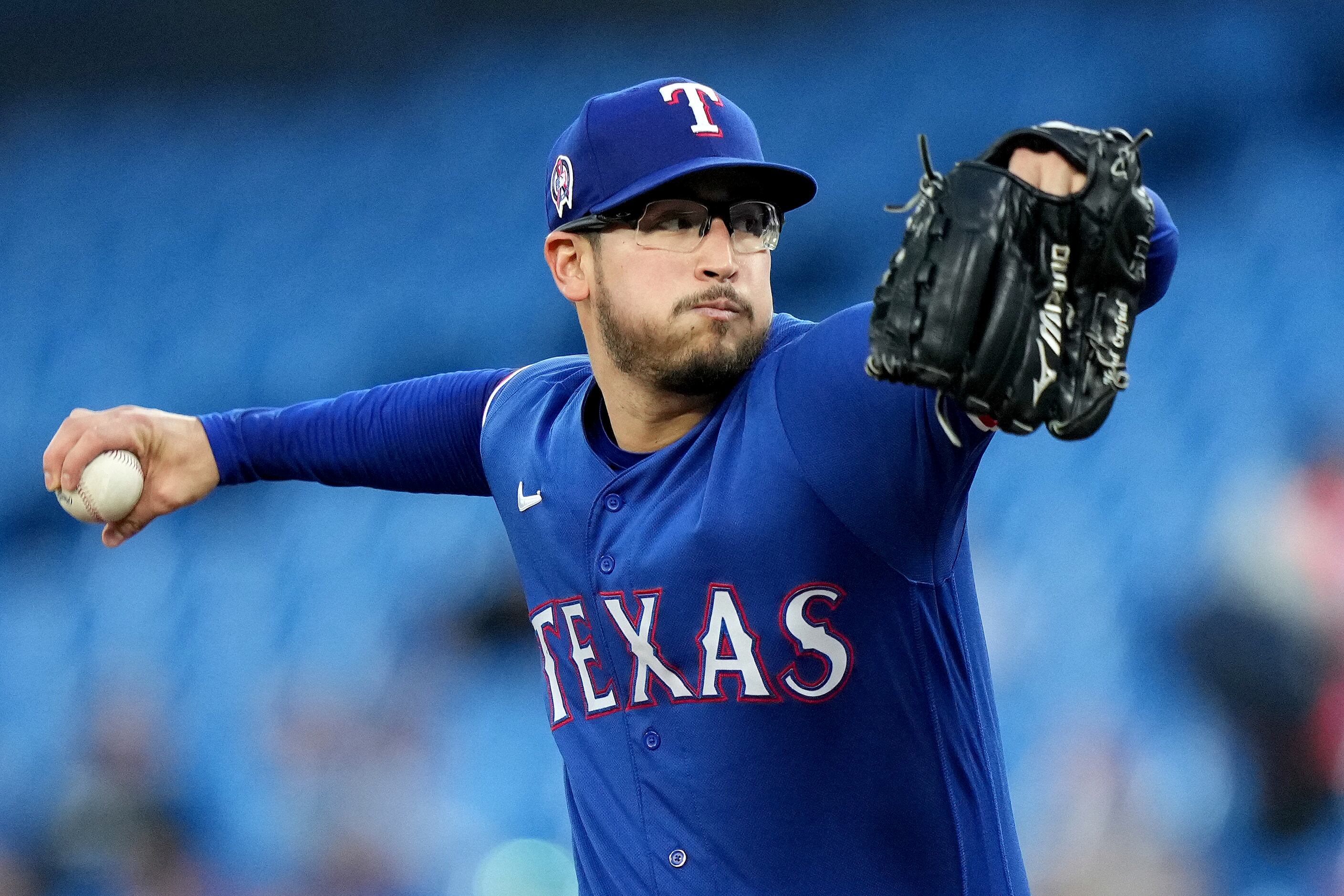 DENVER, CO - AUGUST 23: Texas Rangers starting pitcher Dane Dunning (33)  pitches during a game between the Texas Rangers and the Colorado Rockies at  Coors Field on August 23, 2022 in