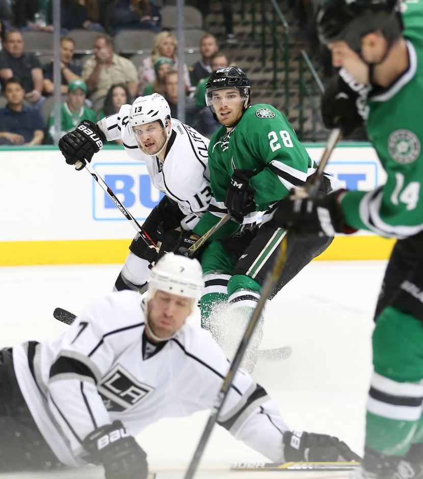 Los Angeles Kings left wing Kyle Clifford (13) and Dallas Stars defenseman Stephen Johns...