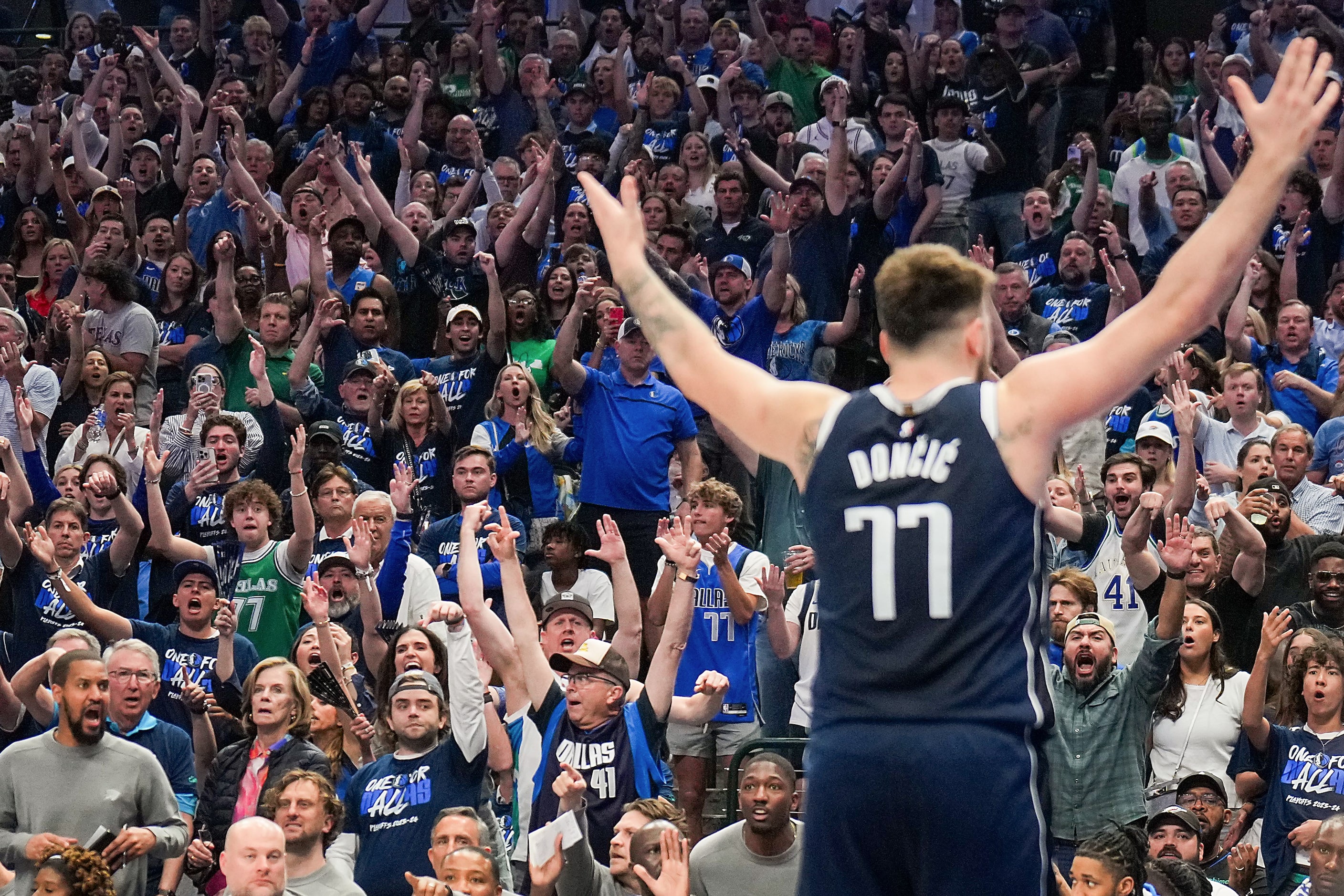 Dallas Mavericks fans celebrate a basket by guard Luka Doncic during the second half in Game...