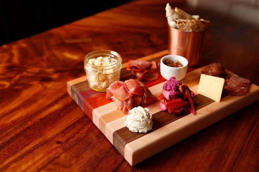 The salumi & cheese board with a selection of artisan cured meats, and Texas and California...