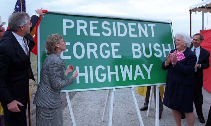 Former first lady Barbara Bush (center right) applauds as David McQueen Laney, commissioner...