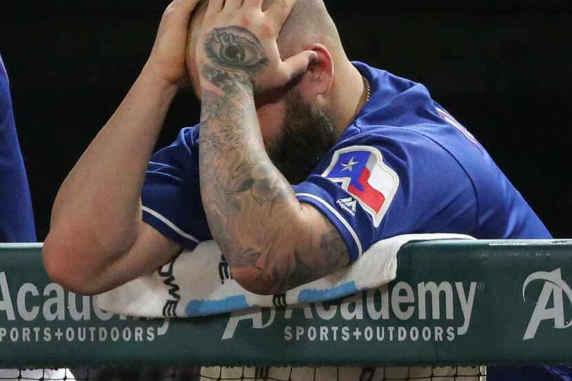 Texas Rangers first baseman Mike Napoli (5) is pictured in the dugout during the Seattle...