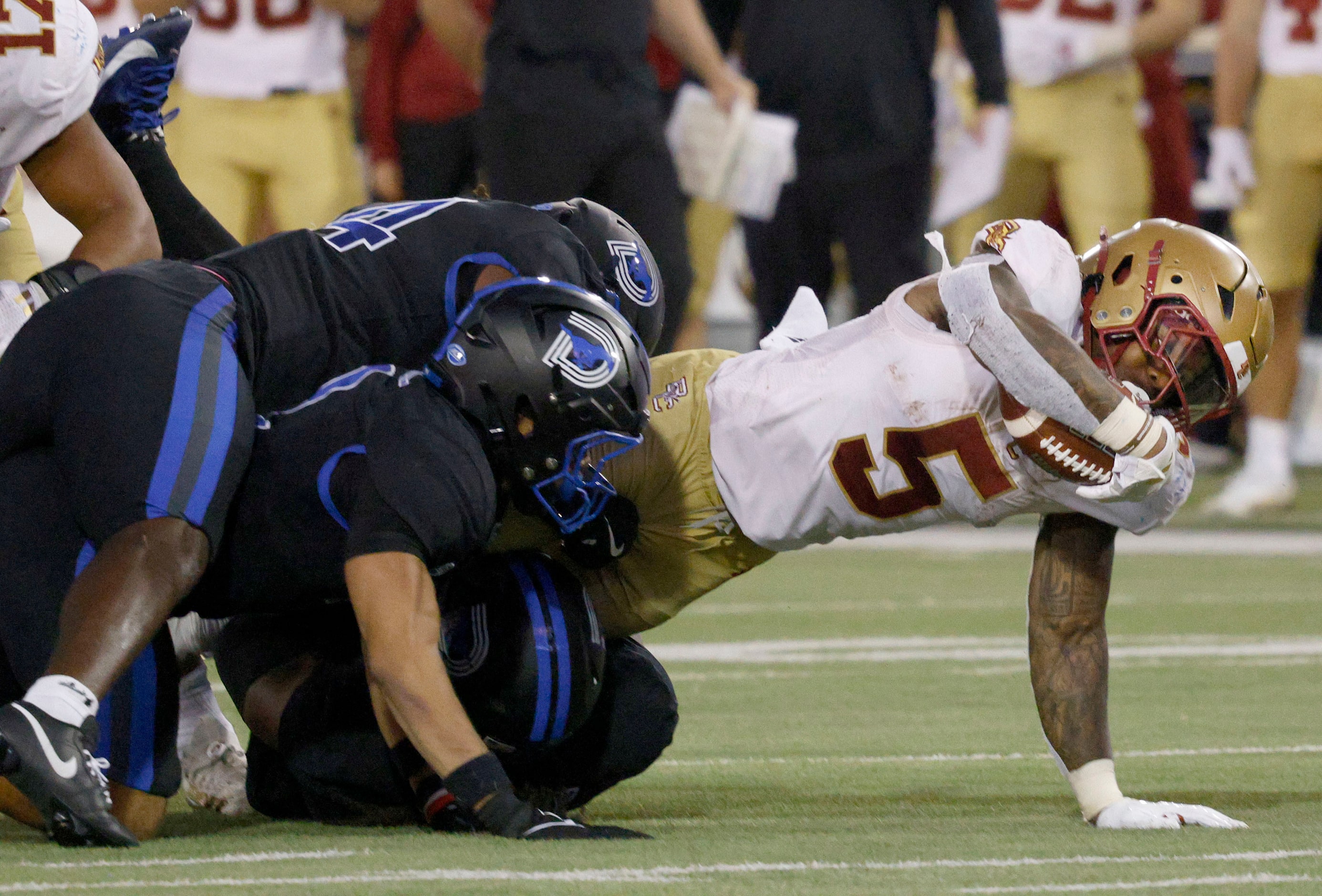 Boston College running back Kye Robichaux (5) is tackled by SMU defense players during the...