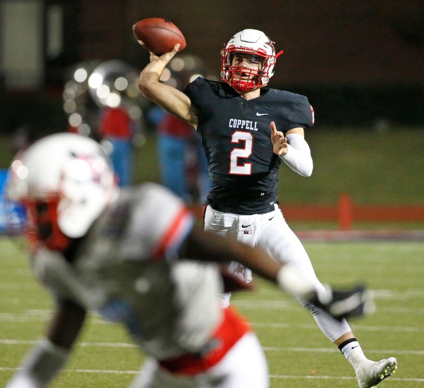 Coppell quarterback Brady McBride (2) throws a second-quoter pass during the Skyline High...