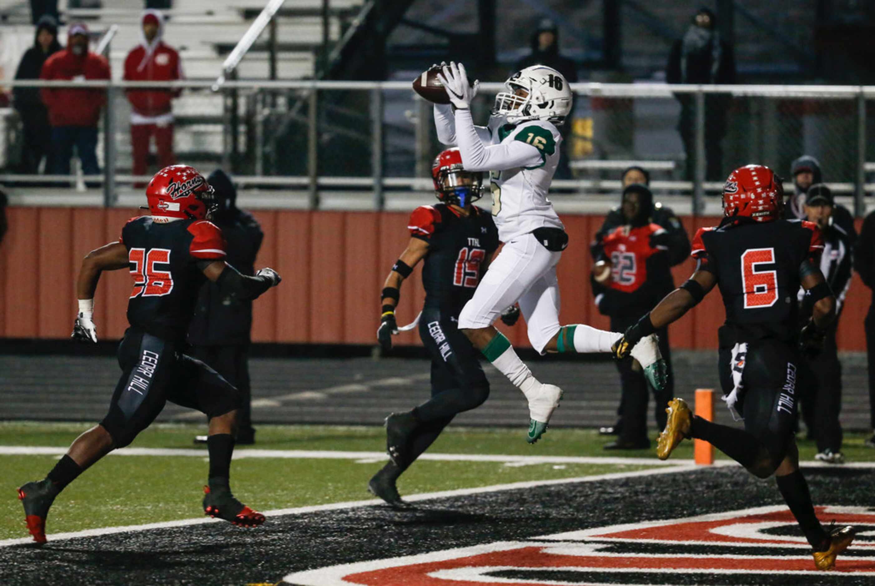 DeSoto wide receiver Ashtyn Hawkins brings down a touchdown pass during a high school...