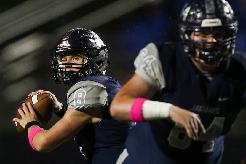 Flower Mound quarterback Blake Short (8) looks to make a pass during the first quarter of a...