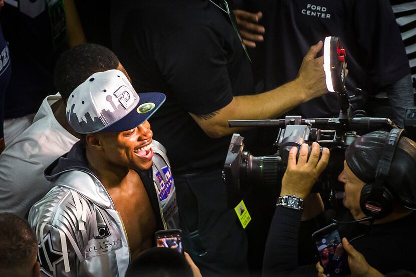 Welterweight champion Errol Spence Jr. celebrates with fans after he defended his IBF world...