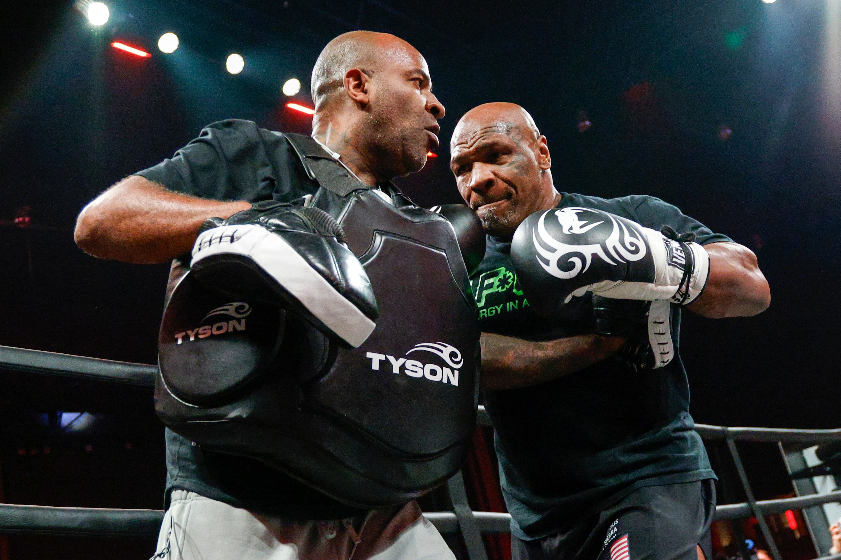 Mike Tyson spars in the ring during an open workout ahead of his upcoming boxing bout...