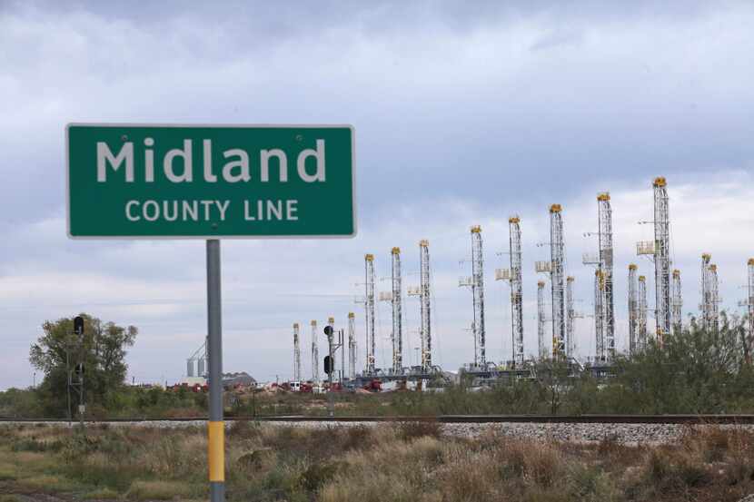 Numerous rigs stand idle at the Midland County Line Thursday, Nov. 17, 2016, in Midland.