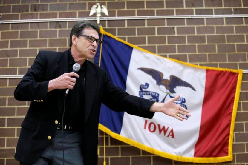 
Texas Gov. Rick Perry speaks to local party activists last month in Algona, Iowa, amid talk...