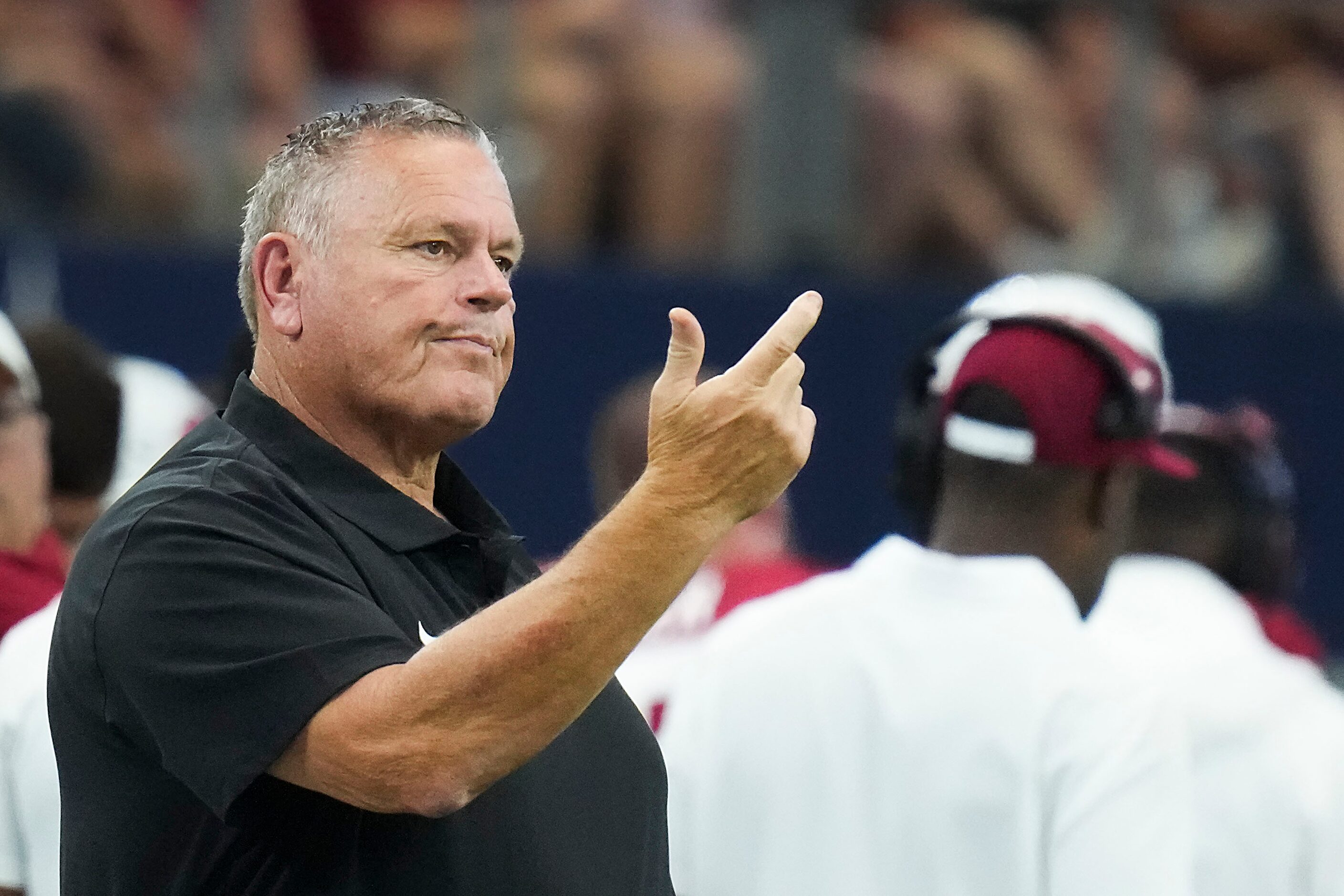 Arkansas head coach Sam Pittman motions to his team during the first half of an NCAA...