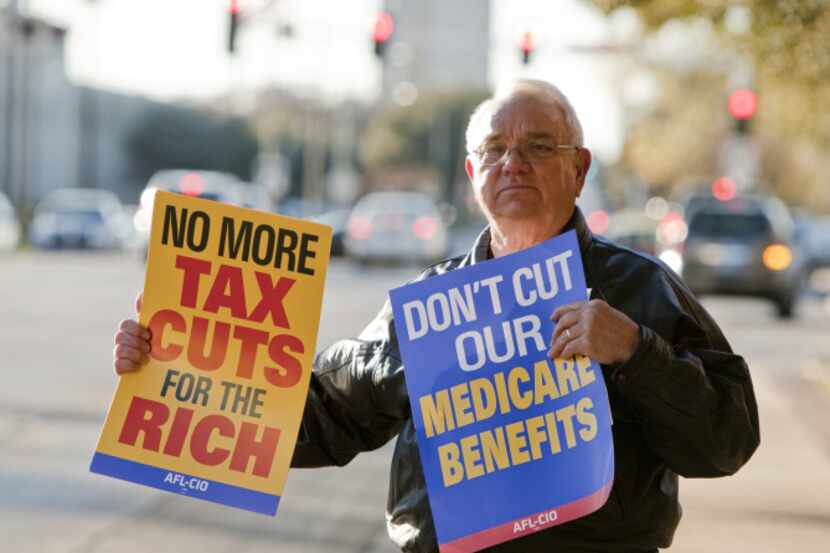 Tommy Christakis of Mansfield protests possible cuts to social security and medicare outside...
