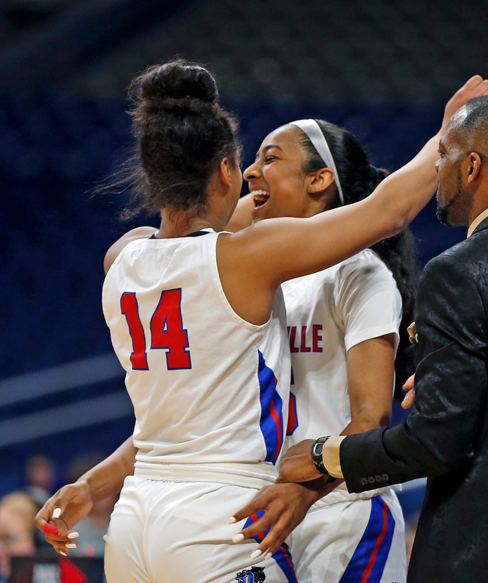 Duncanville guard Deja Kelly #25 celebrates with Duncanville guard Kiyara Howard-Garza #14...