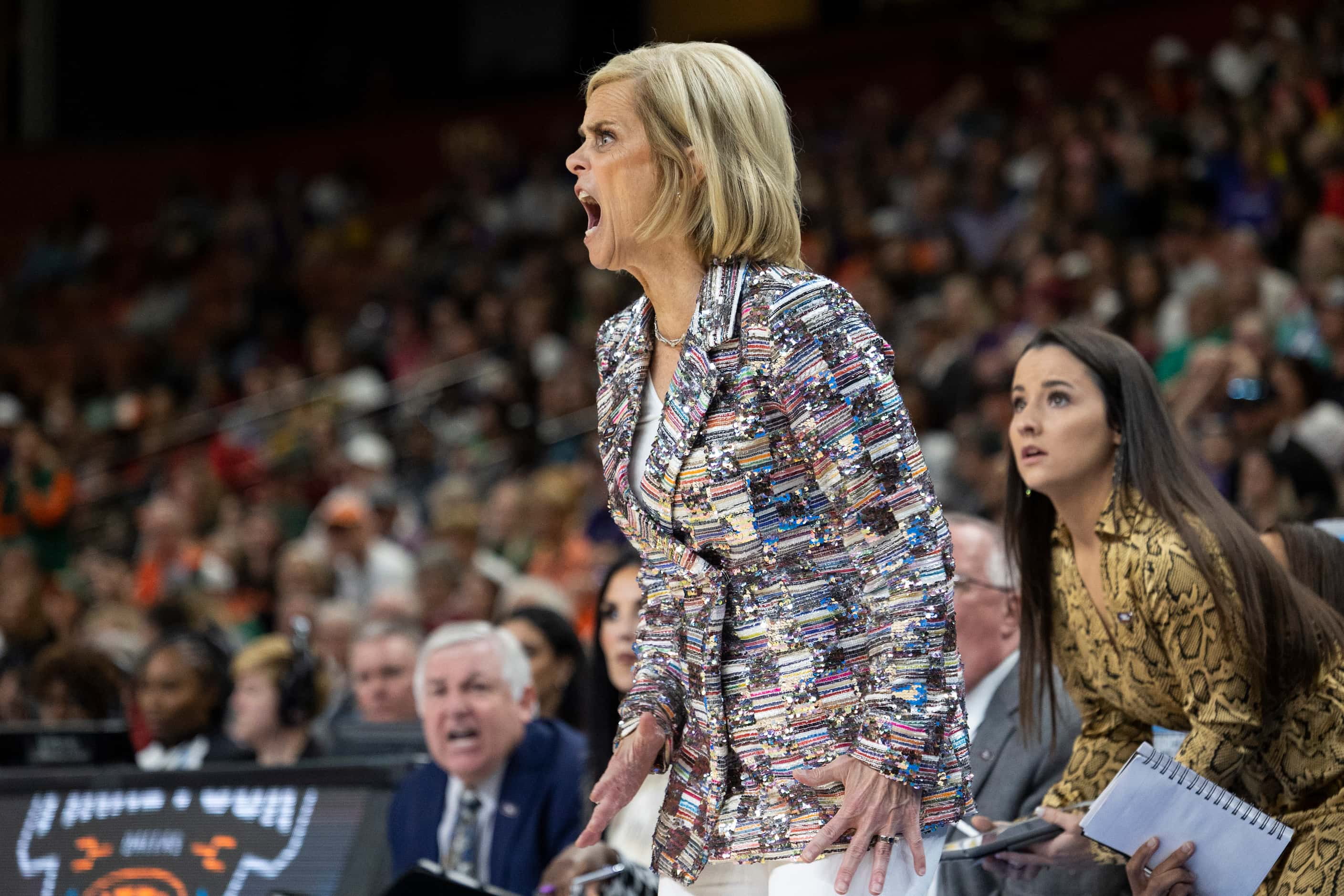 LSU head coach Kim Mulkey yells during the first half of an Elite 8 college basketball game...