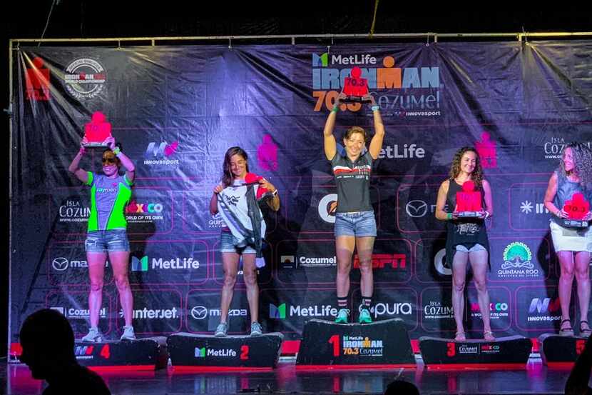 Brandi Grissom Swicegood  (center) on the podium at the 70.3 Cozumel awards ceremony