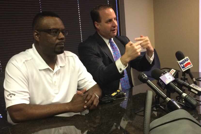 Sean Harrison, left, the older brother of mental patient Jason Harrison, who was shot and...