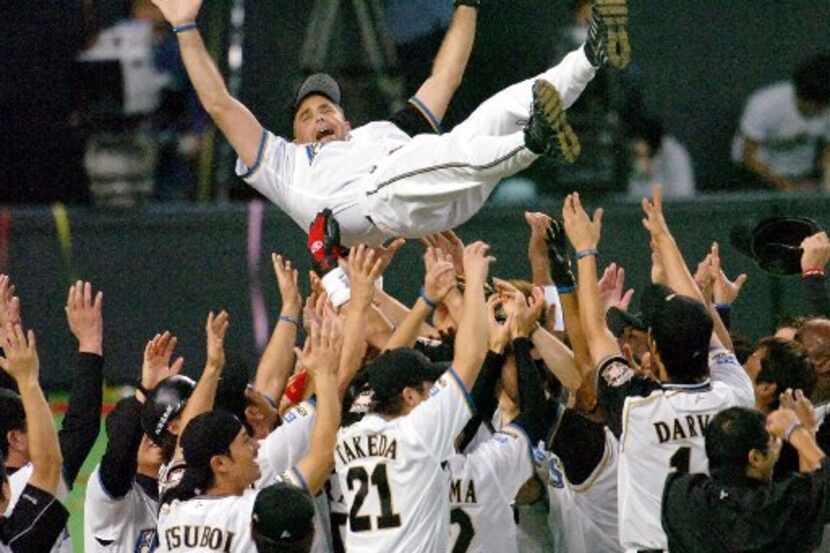 ORG XMIT: *S0418124566* Nippon Ham Fighters manager Trey Hillman is tossed into the air by...