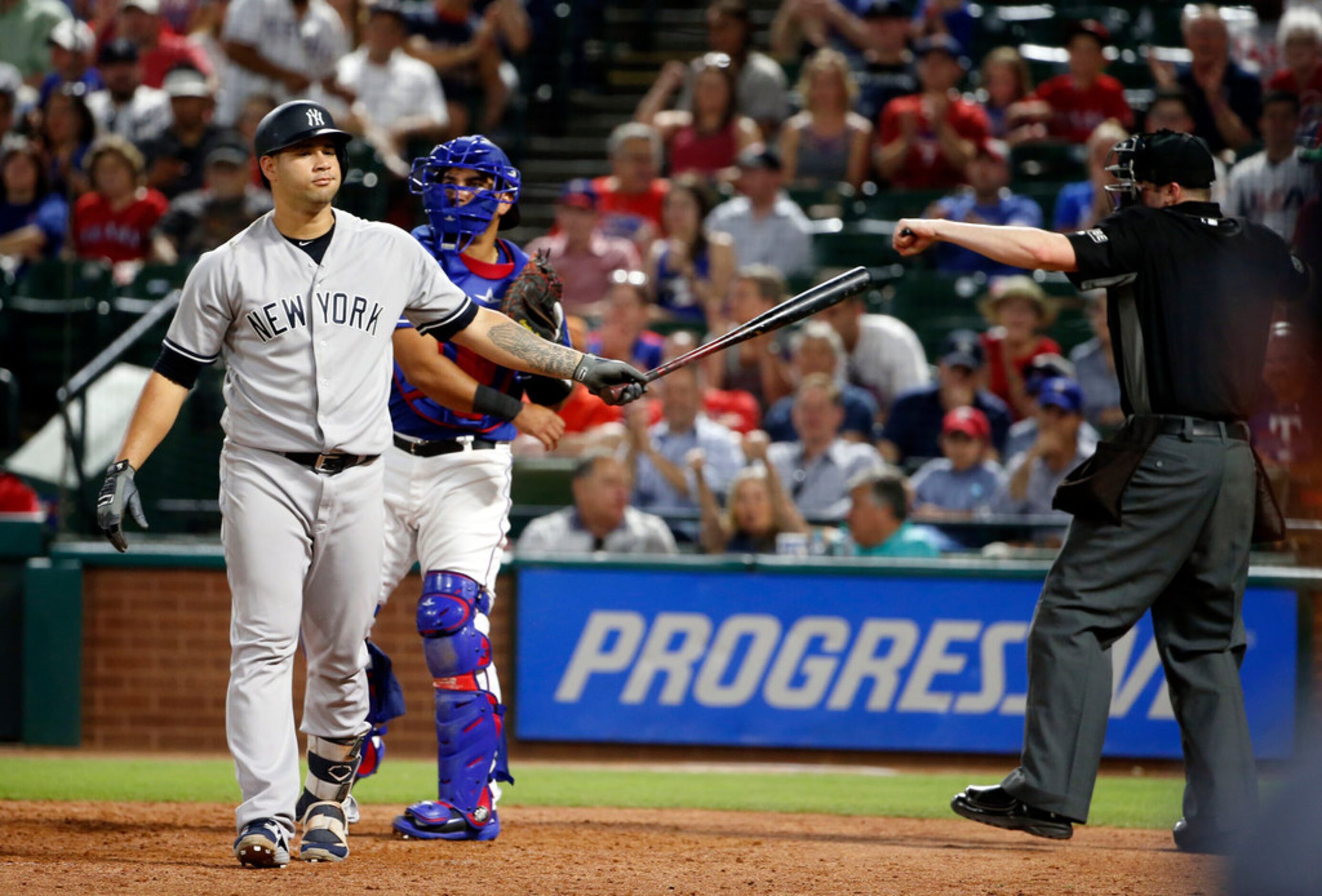 New York Yankees Gary Sanchez (24) reacts to being called out on strikes by umpire Nic Lentz...