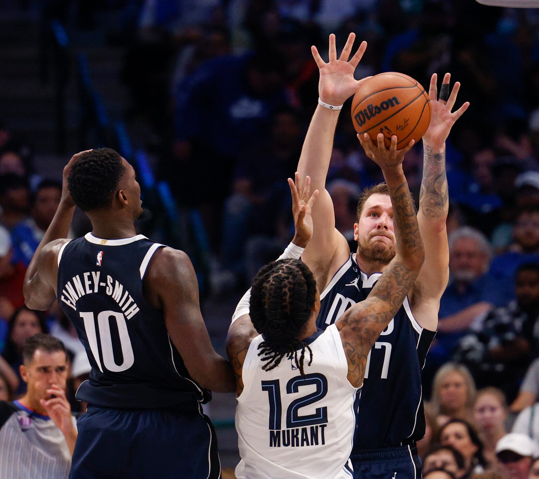 Dallas Mavericks guard Luka Doncic (77) defends against Memphis Grizzlies guard Ja Morant...