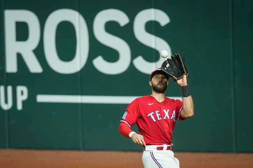 Texas Rangers right fielder Joey Gallo makes the catch on a sacrifice fly off the bat of...