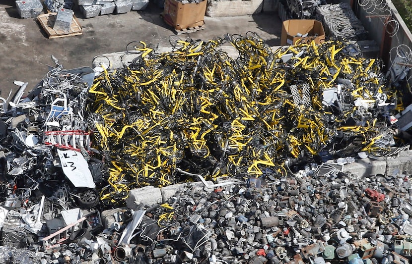 Hundreds of yellow Ofo rental bikes that once populated downtown Dallas sidewalks are now in...