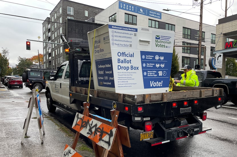 A replacement ballot drop box is unloaded on Monday, Oct. 28, 2024, in Portland, Ore. ...