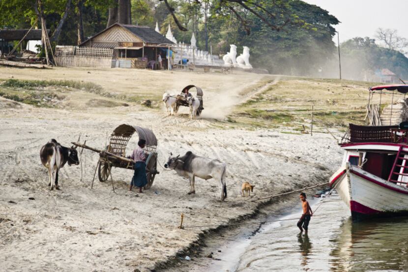 Cartdrivers close to the red pagoda of Mingun, upstream along the Irrawaddy from Mandalay.