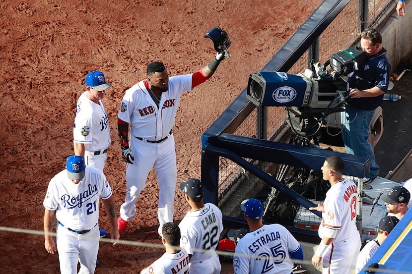 David Ortiz of the Boston Red Sox takes a curtain call after being lifted for a pinch runner...