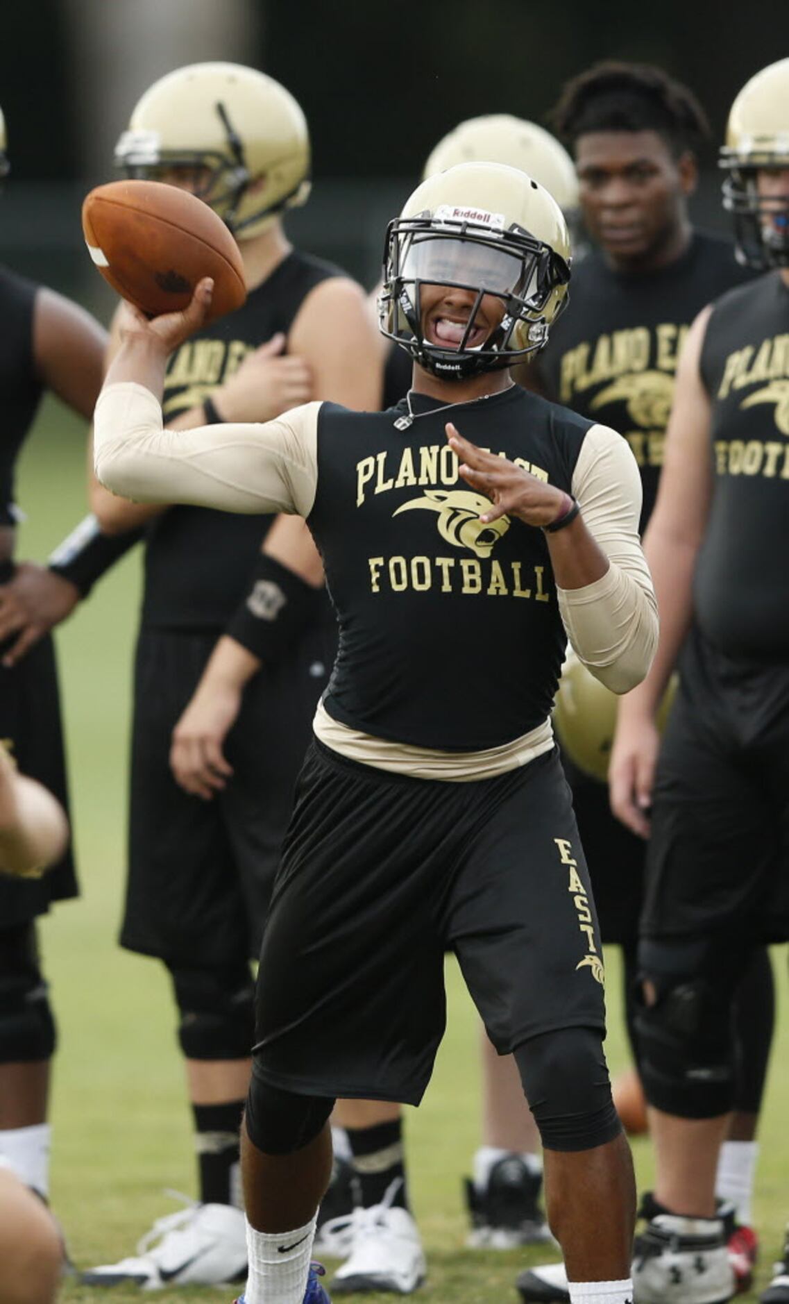 Plano East's quarterback Miles Thompson throws the ball on a play during the first day of...