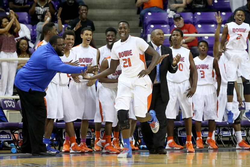 The Arlington Bowie bench reacts to a three-pointer made by Volunteers forward Kevin Hervey...