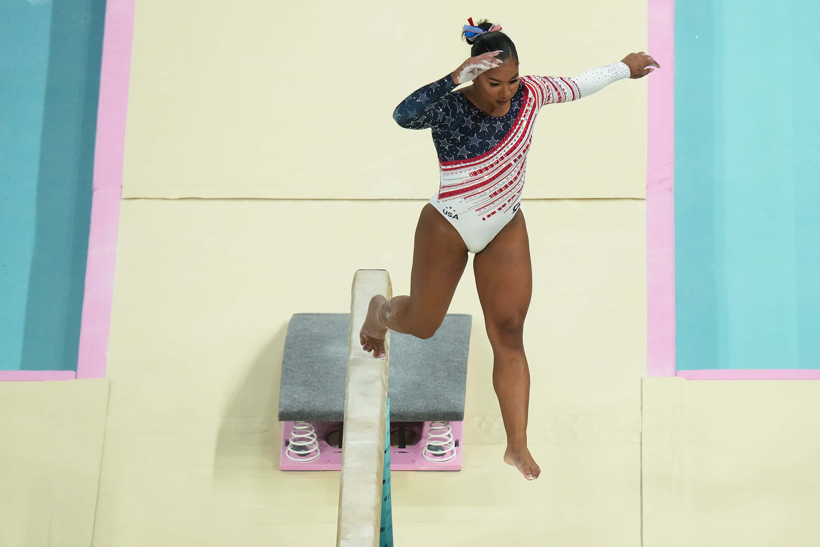 Jordan Chiles of the United States steps off the apparatus as she competes on the balance...