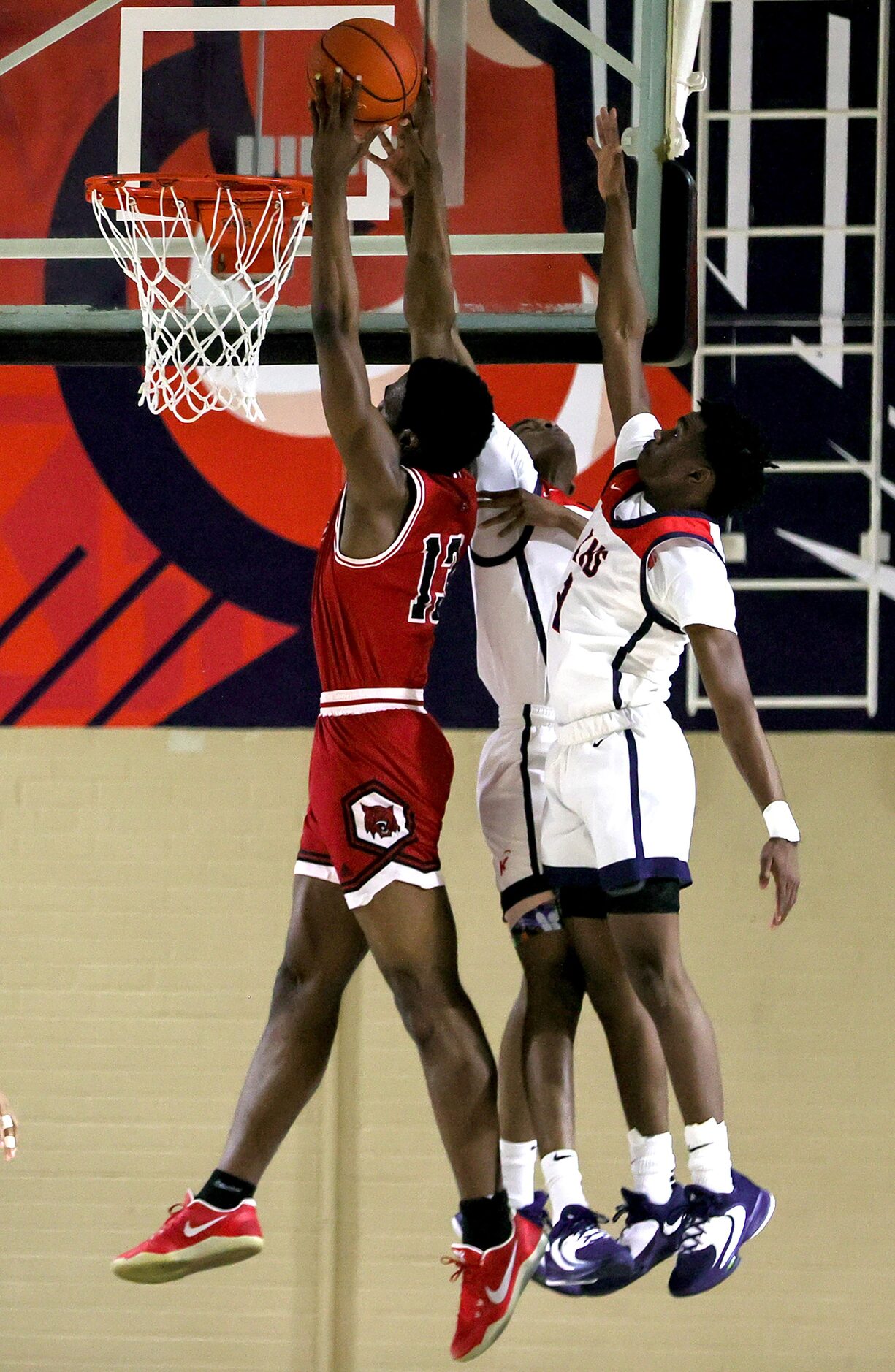 Woodrow Wilson forward Isaac Onuoha (13) tries to dunk the ball against Kimball guard...