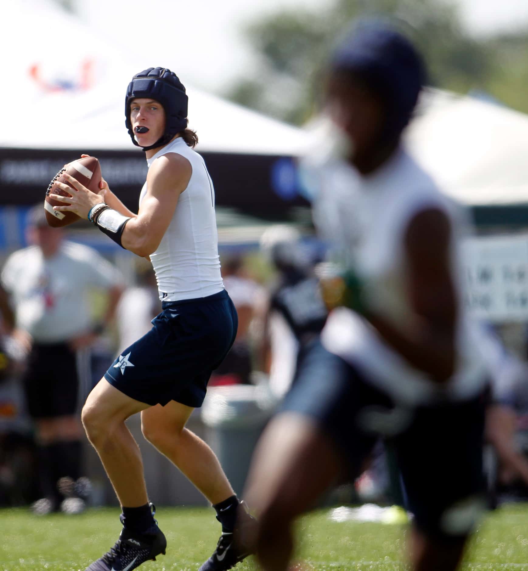 Little Elm quarterback John Mateer (1) prepares to deliver a pass downfield during day 1...