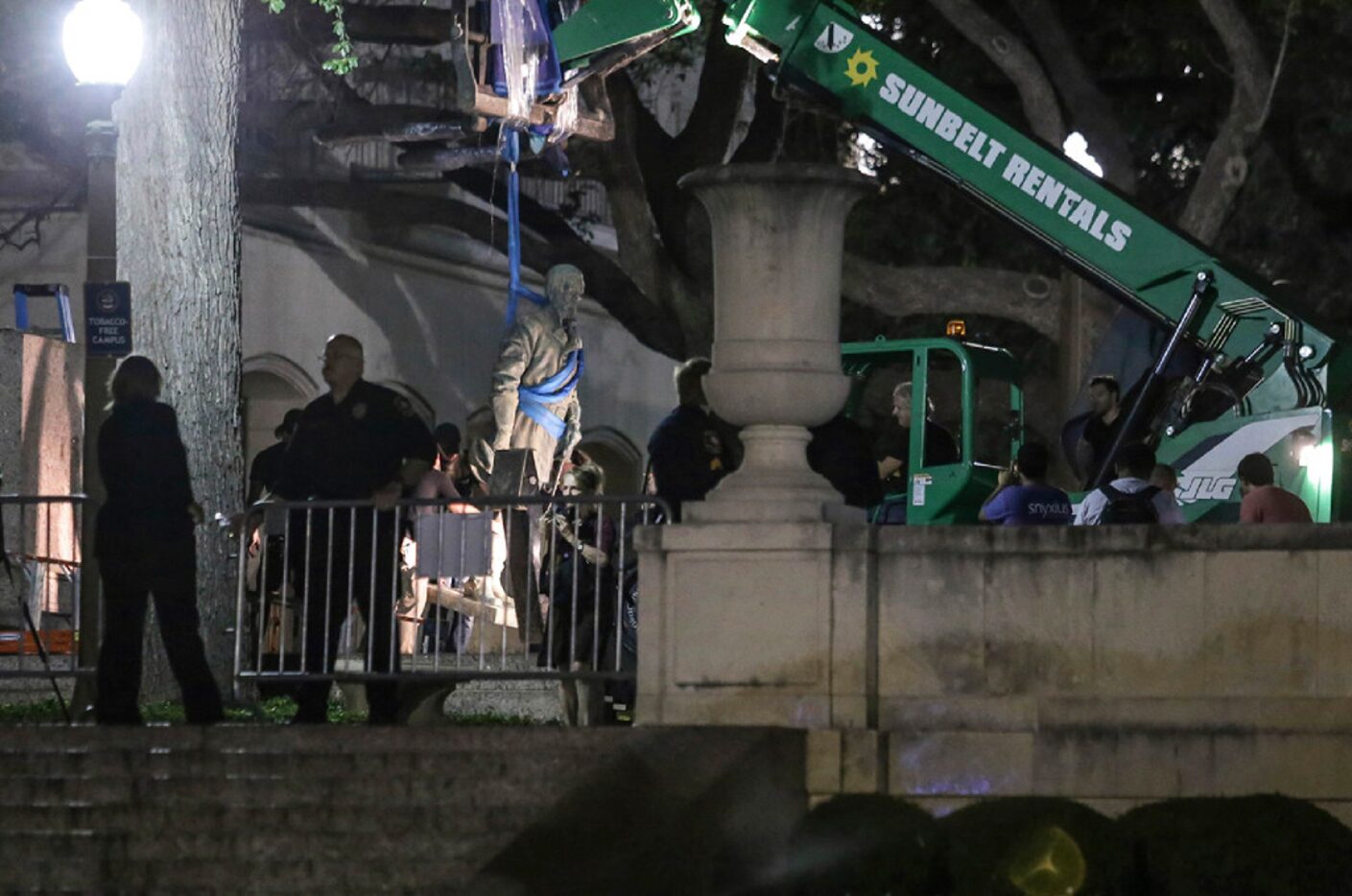 Confederate statutes are removed from the University of Texas early Monday, Aug. 21, 2017,...