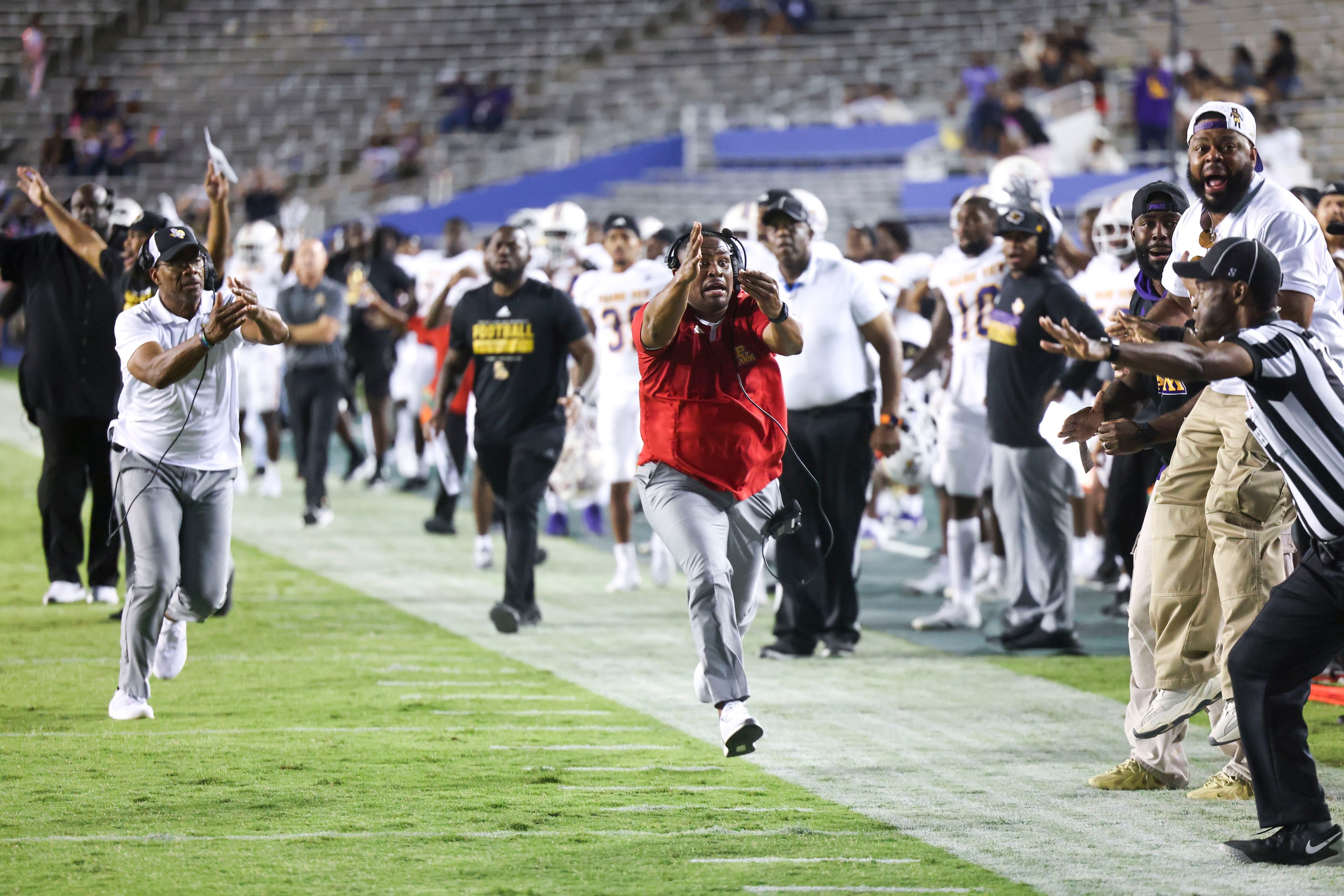 Prairie View A&M  officials including head coach Bubba McDowell (left) calls for a touchdown...