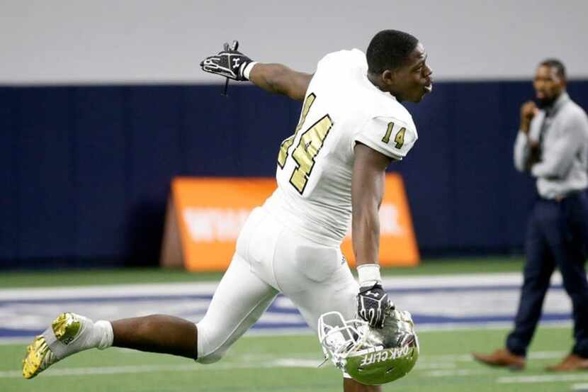 South Oak Cliff defensive lineman Steven Parker (14) celebrates their win over Frisco in the...