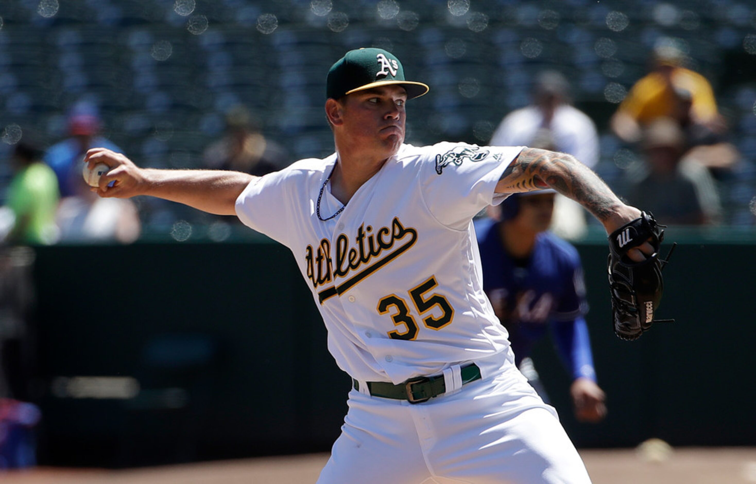 Oakland Athletics pitcher Aaron Brooks throws against the Texas Rangers during the first...