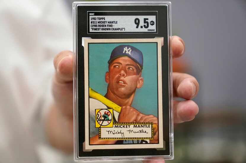 FILE - A Mickey Mantle baseball card is displayed at Heritage Auctions in Dallas, on July...