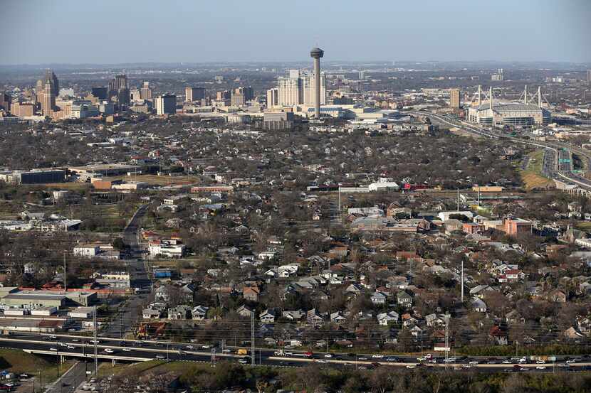 The San Antonio skyline is viewed from south to north as traffic moves along U.S. 90, bottom...