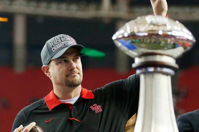  In this Dec. 31, 2015, file photo, Houston head coach Tom Herman celebrates after defeating...