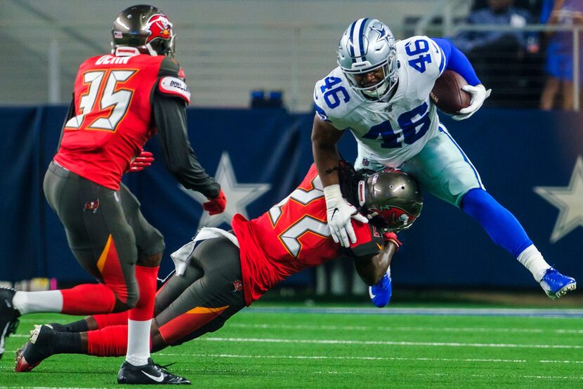 Dallas Cowboys running back Jordan Chunn (46) is brought down by Tampa Bay Buccaneers...