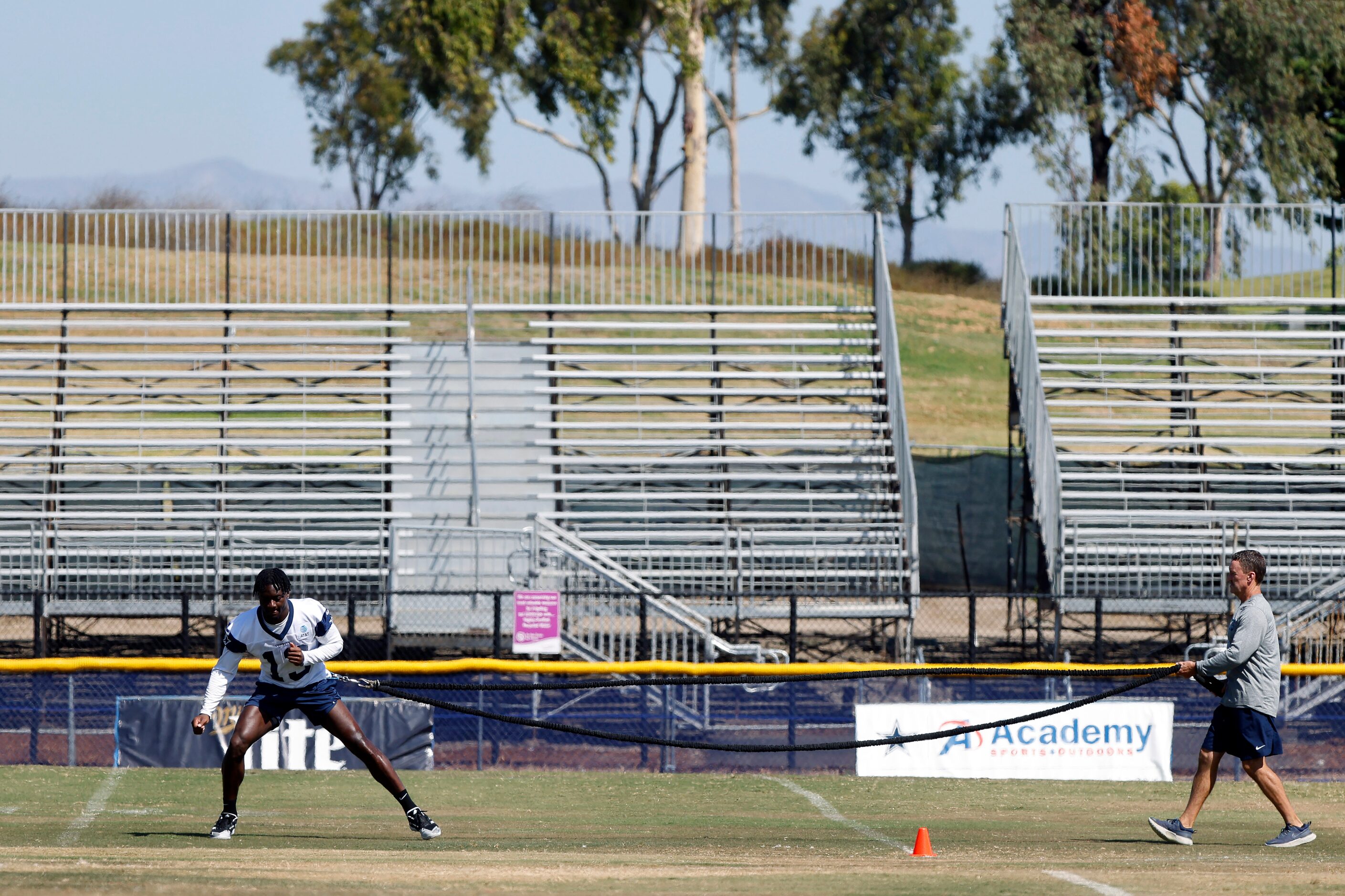 Dallas Cowboys wide receiver Michael Gallup (13) works with head athletic trainer Jim Maurer...