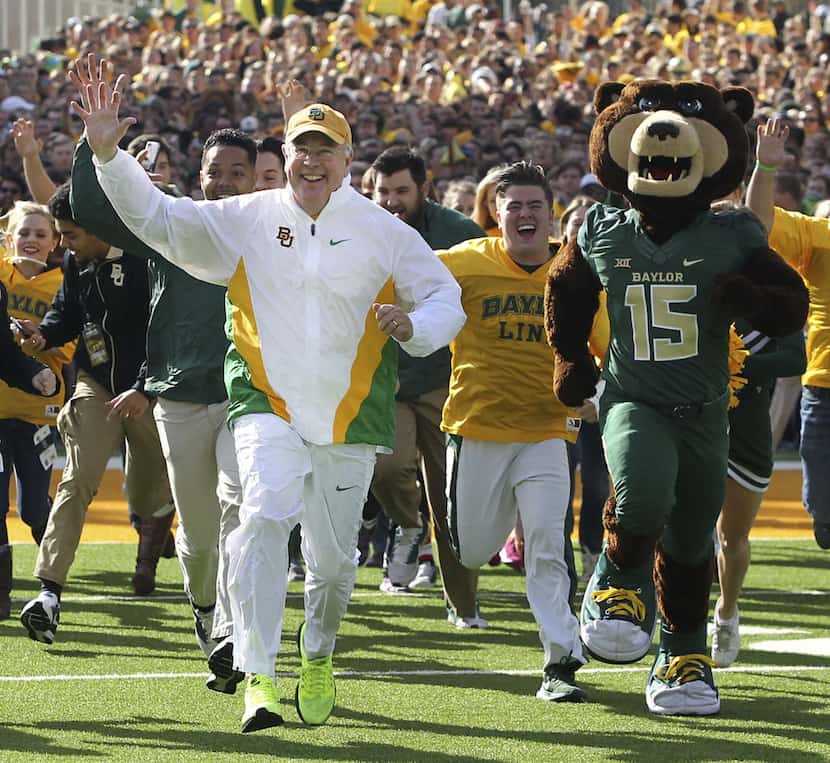 When he was president of Baylor University, Ken Starr ran out on the field before the Bears...