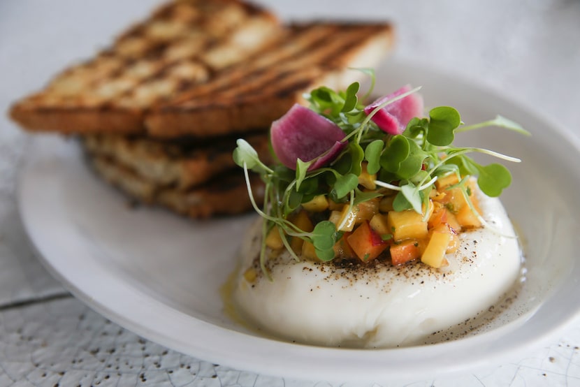 A queso burrata with Texas peach salsa at Jose restaurant in Dallas.