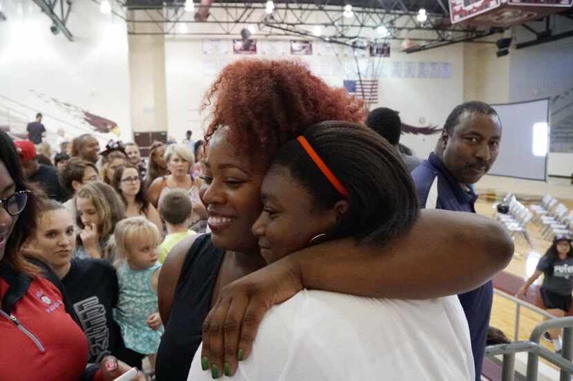 Michelle Carter hugs Darielle Haynes during a send off for Michelle at Red Oak High School...