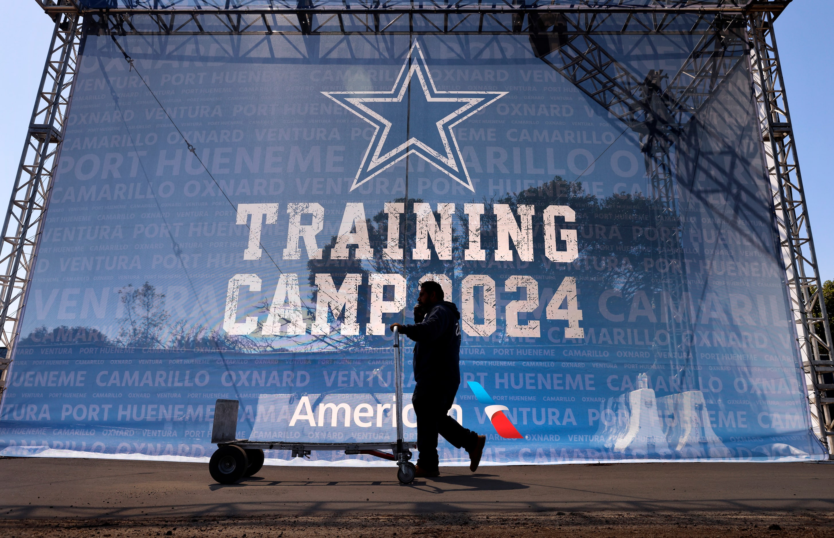 Workers continue to build out the 2024 Dallas Cowboys Training Camp at the Residence Inn...